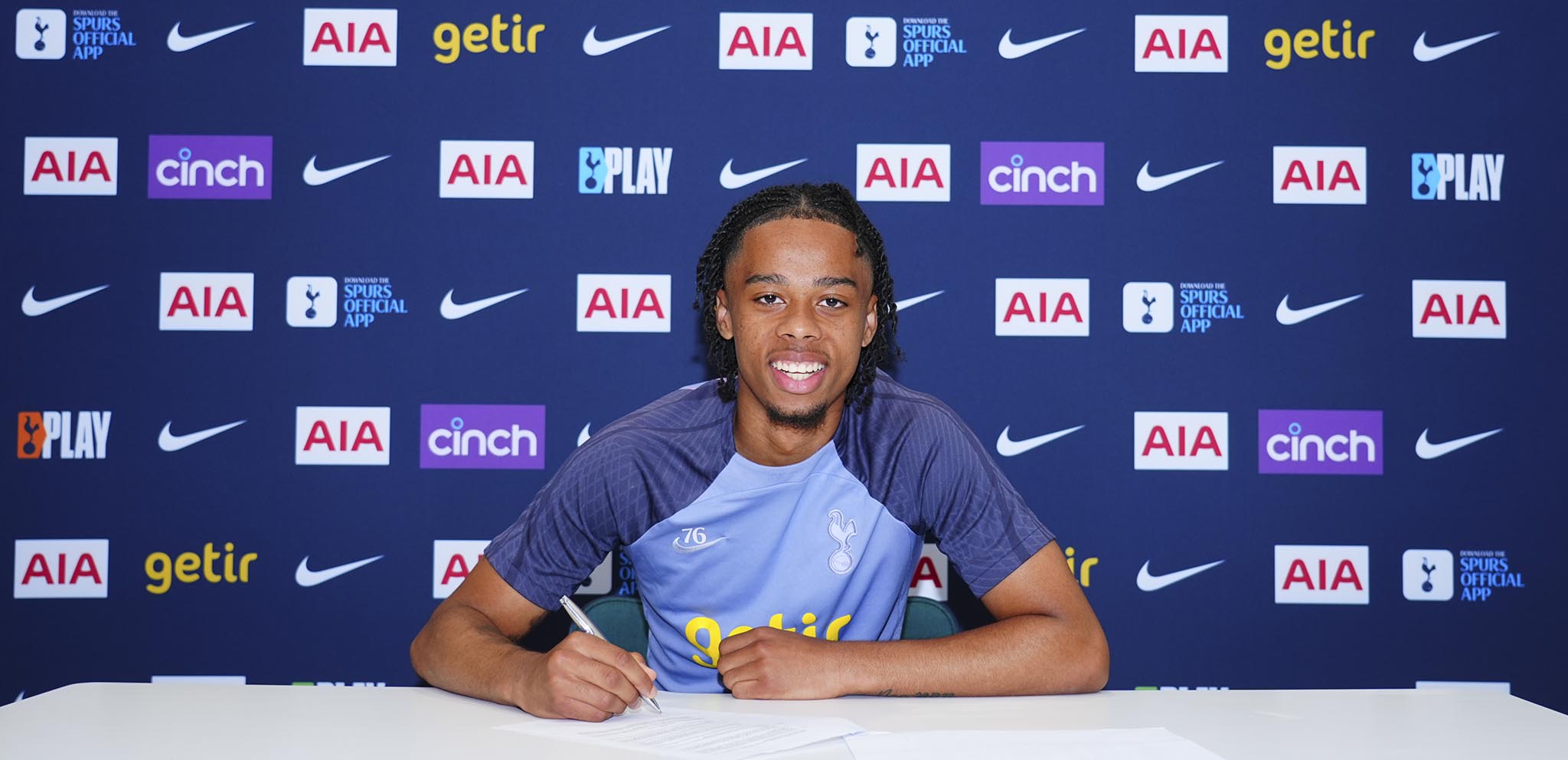 Tyrese Hall signs his Tottenham Hotspur contract in May 2024